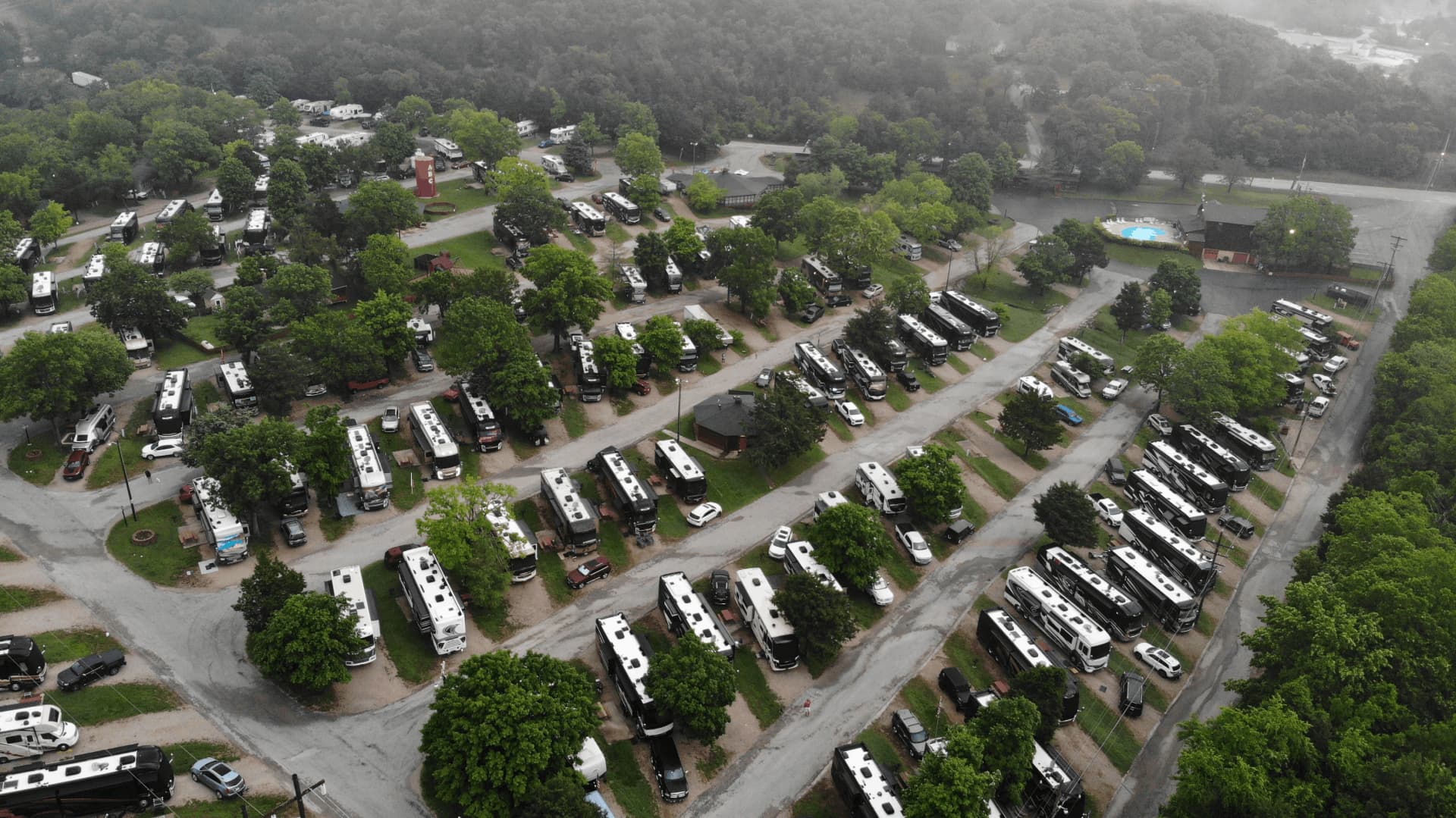 A large number of RVs parked in a lot