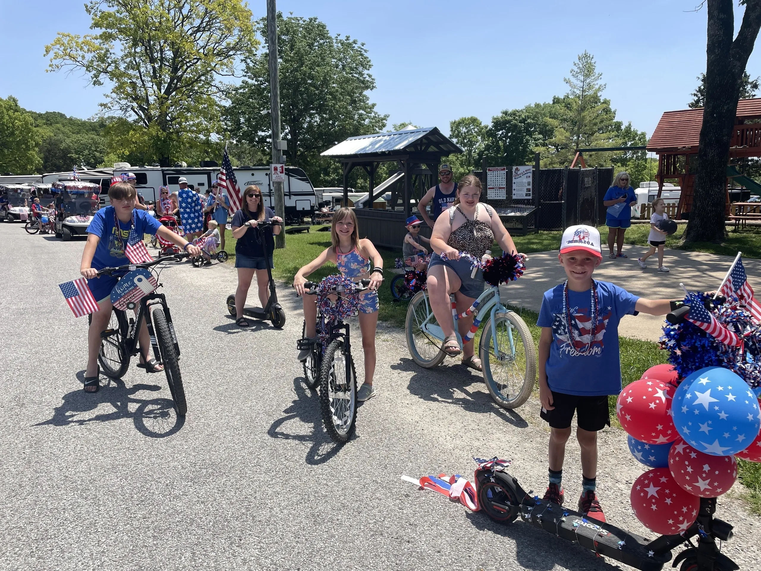 A group of children riding bicycles on a road