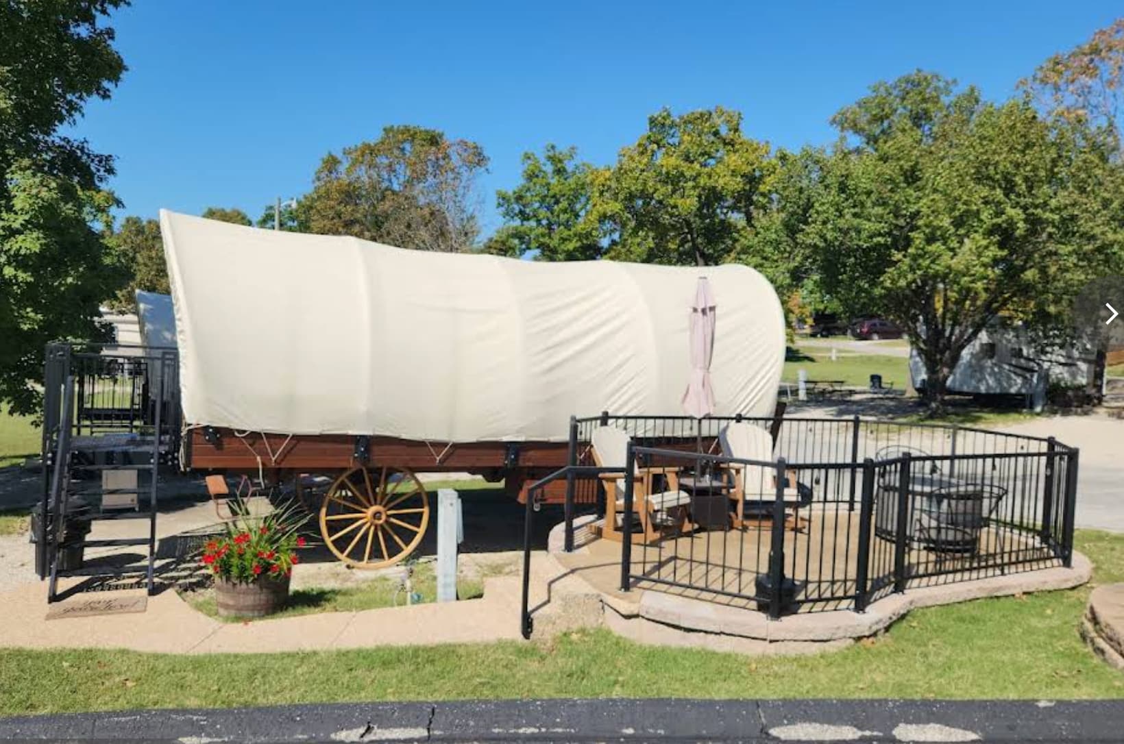 A large wagon is parked on the side of the road